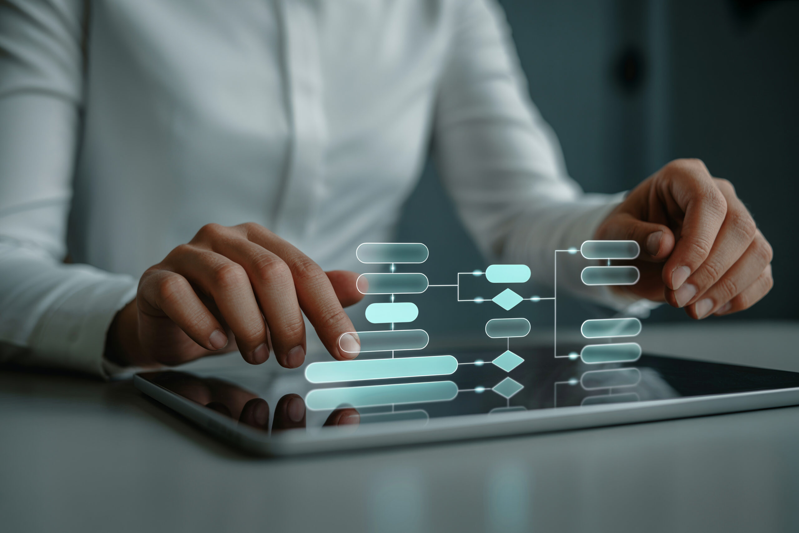 Businesswoman uses tablet to interact with digital flowcharts and organizational diagrams for project management and strategy planning.